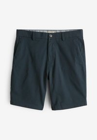 Bermudas azul marino hechas de una tela ligera, con cierre de botón y bolsillos en los costados, con dobladillos bien cosidos.