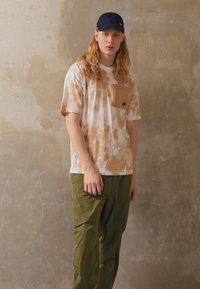 Nike Sportswear Triko s potiskem - beige/black