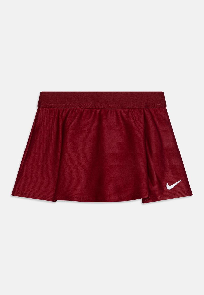 Skort rojo hecho de un tejido ligero y transpirable con un diseño acampanado y una cinturilla elástica. Presenta un logo de Nike en blanco en el dobladillo.