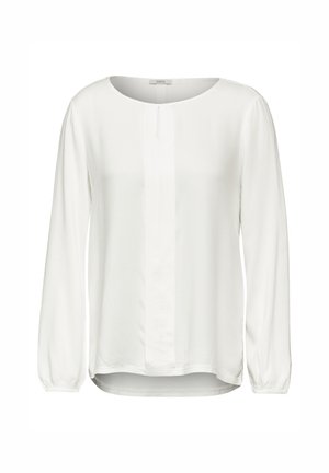 Bílá halenka s dlouhým rukávem a kulatým výstřihem, texturovaná látka, středový skládací detail a elastické manžety. Nabízí uvolněný střih a zakřivený lem.