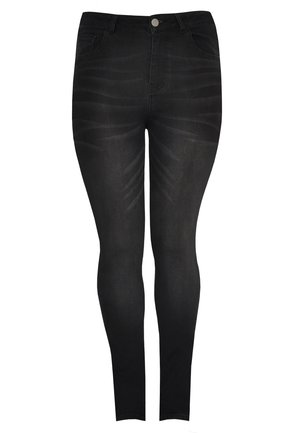 Black skinny jeans made of denim, featuring a smooth texture, five pockets, a button fly, and subtle fading patterns on the legs.