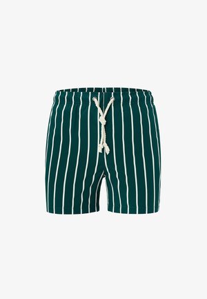 Tummanvihreät uimashortsit, joissa on valkoiset pystysuorat raidat ja valkoinen nyöri solmittuna solmuun joustavan vyötärönauhassa.