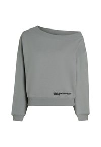 Jersey gris claro con diseño de un solo hombro, puños y cintura acanalados. Presenta "KARL LAGERFELD JEANS" bordado en negro cerca del dobladillo.