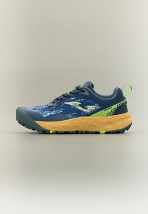 Chaussure de sport bleue et verte avec dessus en mesh à motifs, semelle épaisse beige et languette au talon, montrée en profil latéral sur fond neutre.
