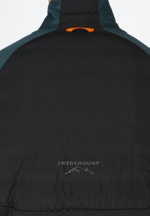 Black padded jacket with teal accents, high collar, and an orange loop. Features brand logo "SWEDEMOUNT" printed in gray near the bottom.