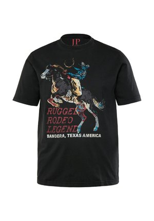 T-shirt en coton noir avec un graphique coloré de rodeo représentant un cow-boy sur un cheval et un texte indiquant "Légende de Rodeo Rugueux, Bandera, Texas Amérique."
