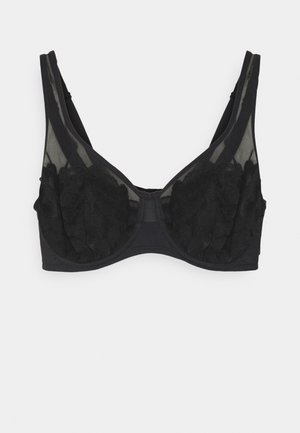 Black bra with sheer mesh panels and textured floral lace detailing. Features wide straps and a hook-and-eye closure at the back.