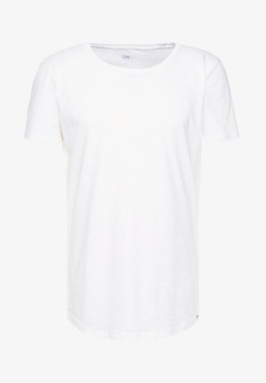 Biała, krótko rękawowa koszulka wykonana z miękkiej bawełnianej tkaniny. Posiada okrągły dekolt oraz luźny krój z dyskretną metką marki na dole.