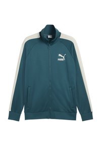 Teal zip-up jakke med cremefarvede detaljer, der har høj krave, sidelommer og et hvidt logo på brystet. Glat, letvægts stof.
