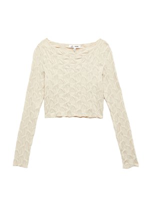 Haut court à manches longues de couleur crème présentant un motif texturé de formes entrelacées et un large col. Tissu doux et léger.