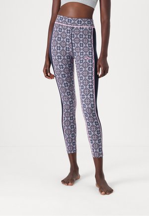 Tights i marineblått og mønstret stoff med rosa geometriske design. Høyt liv med kontrasterende sidepaneler. Mykt, elastisk materiale.