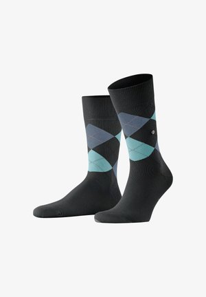 Pair of black crew socks with blue and gray argyle pattern on calves, shown standing upright on white background.