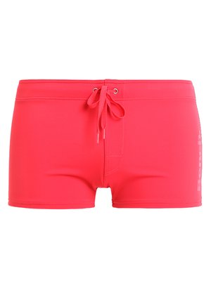Pink swim shorts made of smooth, stretchy material. They feature a drawstring waistband and a small logo on the side.