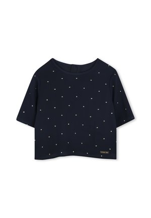 Top court bleu marine avec des manches courtes, un col rond, et orné de petits clous dorés sur le tissu. Étiquette sur le côté.