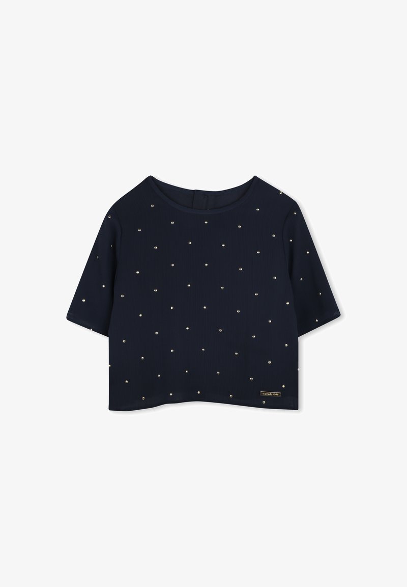 Top court bleu marine avec des manches courtes, un col rond, et orné de petits clous dorés sur le tissu. Étiquette sur le côté.