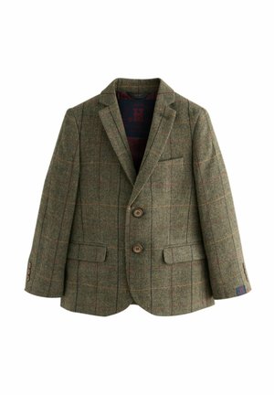 Roheline tweed bleiser, millel on kalasabamuster ja punased ja kollased ruudulised jooned. Tuntud omadused on kaks nuppu ja tasku.