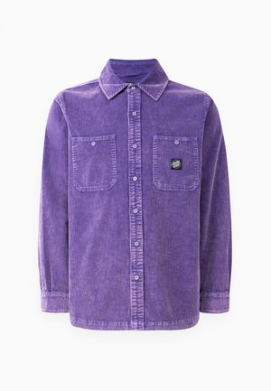 Purple corduroy shirt with a collar, two front pockets, and a small logo patch. Features button-down front and long sleeves.