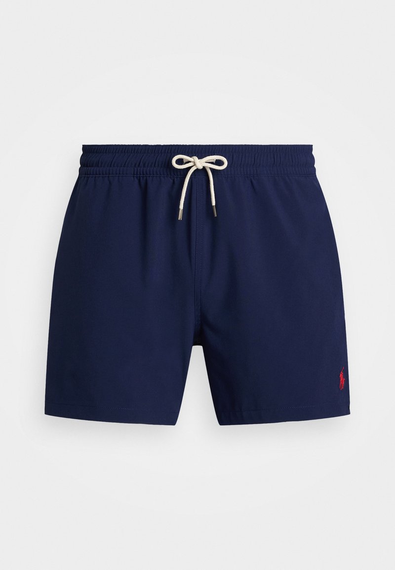 Marindunkla badbyxor i marinblått med elastisk midja och en kontrasterande snörning. Har en liten röd logotyp på nedre högra sidan.