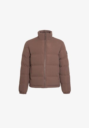 Ruda pūkuota striukė su aukštu apykakle, priekyje užtrauktuku ir elastiniais rankogaliais. Pasižymi paprastu dizainu su siuvinėjimo detalėmis ir logotipo akcentu.