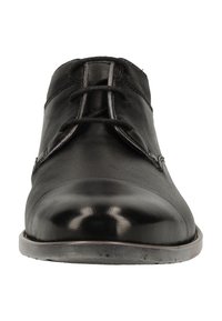 Chaussure habillée en cuir noir avec laçage fermé, bout arrondi et col en tissu texturé, vue de face sur fond blanc.