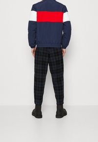 Tommy Jeans Allvädersjacka - dark blue