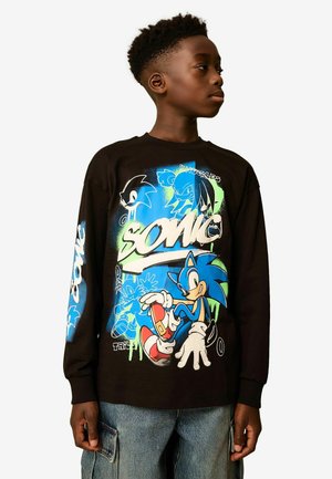 Black long-sleeve t-shirt featuring colorful Sonic the Hedgehog graphics, with blue, green, and white accents against a dark background.