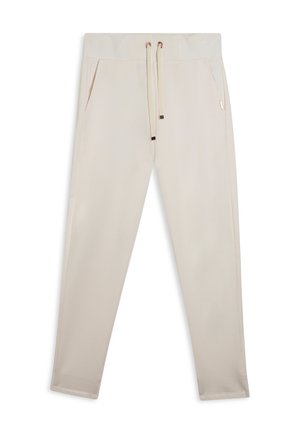 Pantaloni da tuta beige realizzati in tessuto morbido, con una vita testurizzata, cordino regolabile e tasche laterali. Vestibilità slim con dettagli a costine.