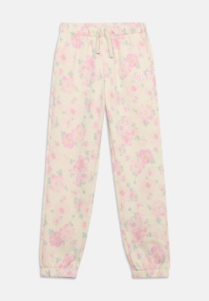 Pantalon de survêtement beige clair pour enfants avec poignets élastiques, imprimé floral rose, taille à cordon de serrage et logo "GAP" brodé sur la cuisse droite.