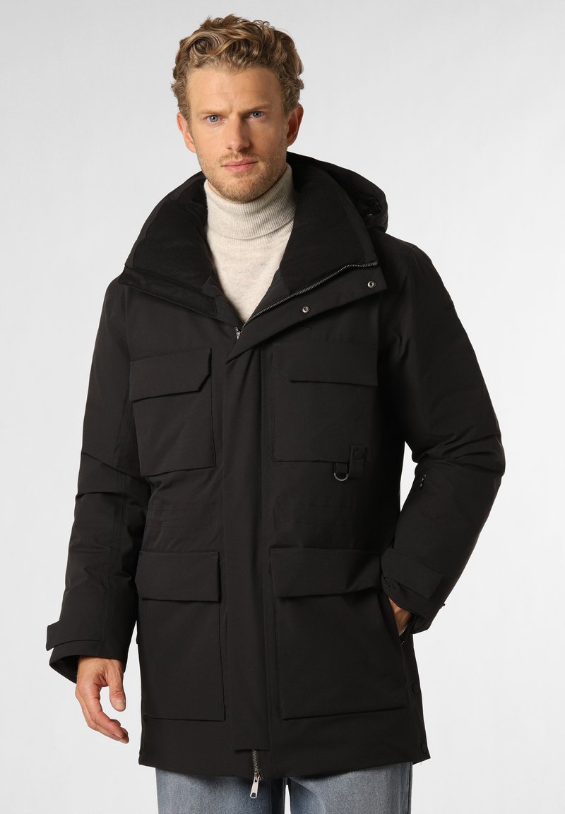 Black parka jacket with a high collar, multiple large front pockets, a drawstring hood, and a zippered front closure. Smooth texture.