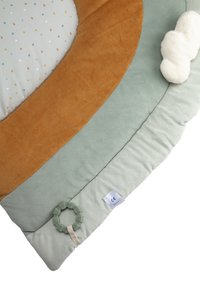 Round play mat featuring soft textures in muted green, brown, and cream, dotted pattern, with a plush cloud accent and an attached toy ring.