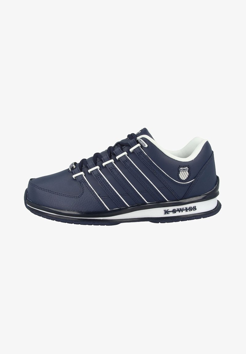 Navy blue athletic shoe with white accents and five prominent stripes. Made of synthetic material with a textured surface and rubber sole.