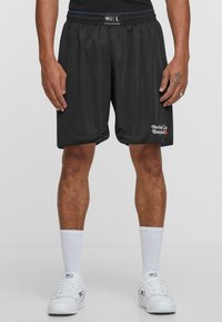 Svarte mesh basketballshorts med avslappet passform, elastisk midje og sidelommer. Har "New York City Basketball" brodert.