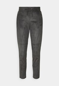 Tmavě šedé zamšové kalhoty s páskem na stažení, zúženým střihem a zipovými bočními kapsami. Hladká textura s panely pro designový detail.