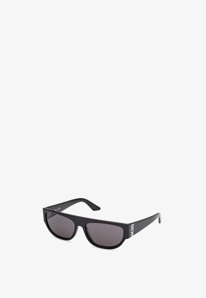 Sunglasses with a black plastic frame, rectangular lenses in gray tint, and the brand "GCOS" in white on the side.