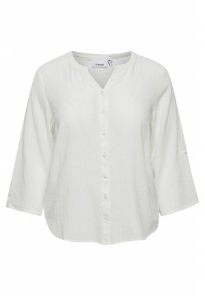 Fehér pamut ing V-nyakkal, gombos elülső résszel és háromnegyedes ujjal. Texturált anyag, laza szabással és lekerekített alsó szegéllyel.