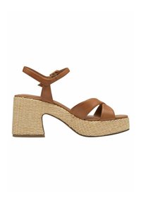 Sandales plateformes en cuir marron avec une semelle intermédiaire en jute tissé, design à large bride et bride de cheville ajustable. Talon bas pour plus de stabilité.