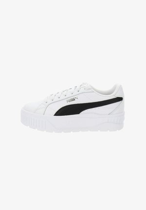 Zapatilla Puma blanca con acentos negros, material de cuero suave, diseño de cordones, punta redonda y suela de goma blanca texturizada.