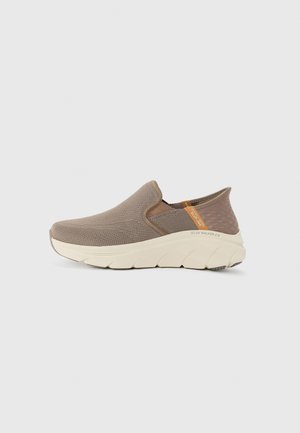 Slip-on sneakers with a breathable taupe mesh upper, cream sole, textured accents, and orange brand label on the side.