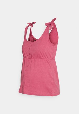 Camiseta de maternidad sin mangas en color rosa, con escote redondo, botones en la parte delantera y tirantes anudados. Confeccionada con tela suave y elástica, de corte cómodo y holgado.