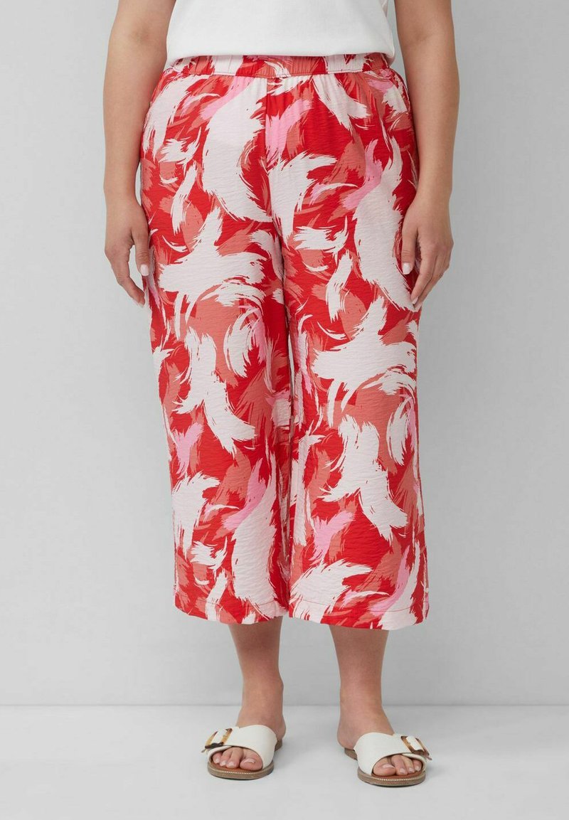 Culottes w kolorze czerwonym i różowym, w wzory, z elastyczną talią, wykonane z lekkiego materiału, charakteryzujące się zwiewnym krojem i skróconą długością.
