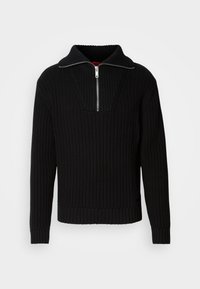 Pull en maille côtelée noire à manches longues avec un col demi-fermeture argenté, présenté sur un fond blanc.