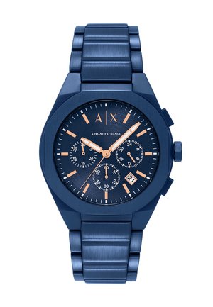 Montre en métal bleu avec un bracelet texturé, boîtier octagonal et cadran bleu foncé. Comprend des marqueurs d'heure orange et trois sous-cadrans, ainsi qu'un affichage de la date.