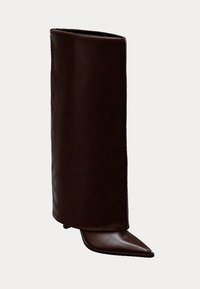 Brown leather ankle-high boot with a cylindrical shaft, pointed toe, and low heel, featuring a smooth texture and minimalistic design.