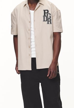 Pegador Camisa - sand