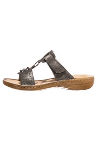 Metallic gray sandal with a thong design, decorative flower detail, and adjustable straps. Features a cushioned insole and stacked sole.