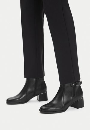 - Botki kowbojki i motocyklowe