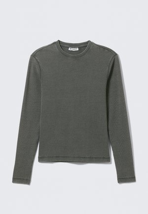 T-shirt à manches longues gris foncé côtelé avec col ras du cou, ourlet droit et détails de coutures visibles, portant l'étiquette "WEEKDAY" à l'intérieur du col.