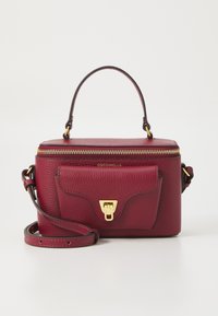 Rectangular burgundy leather handbag with top handle, front pocket with gold clasp, zipper closure, and adjustable shoulder strap.
