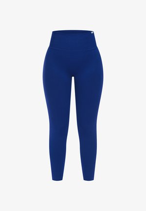 Wysokiej talii niebieskie legginsy wykonane z gładkiego, elastycznego materiału. Charakteryzują się dopasowanym krojem i długością do kostek. Brak widocznych wzorów lub akcentów.