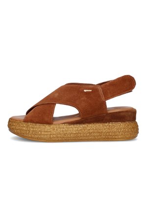 Sandalo con zeppa in suede marrone con cinturini incrociati, punta aperta, cinturino posteriore regolabile e suola platform intrecciata.